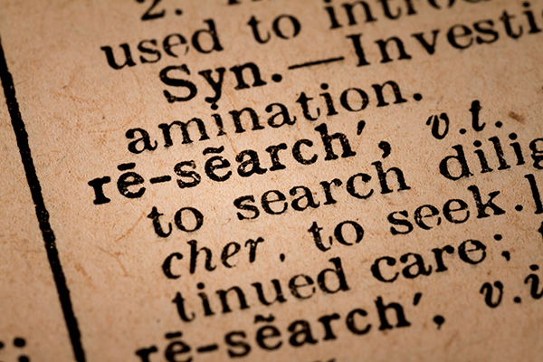 close up of a dictionary entry on research