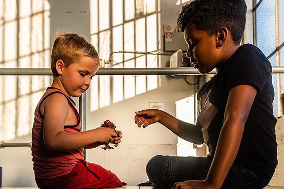 Toy small boys playing with a toy